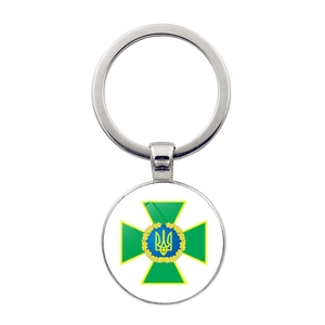 Detailed view of silver alloy keychain featuring the Ukraine coat of arms emblem