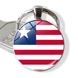 Detail of Liberia flag glass cabochon keyring with silver alloy metal ring and key