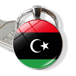 Detail of Libya flag keychain featuring glass cabochon dome and silver alloy metal ring