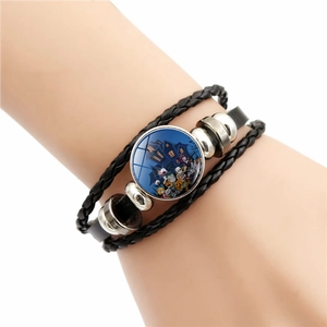 Gevlochten leren armband met meerdere lagen en Halloween glasbedeltje met pompoen