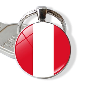 Macro view of Peru national flag glass pendant keychain with silver metal base