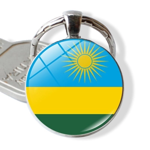 Macro detail of Rwanda flag glass cabochon keychain in silver finish zinc alloy