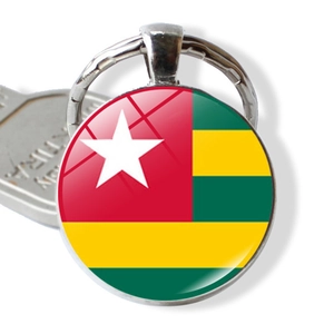 Round silver keychain featuring Togo flag design under glass dome with split ring