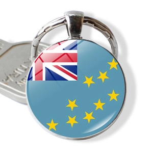 Close-up of Tuvalu flag keychain with glass dome and polished silver metal ring