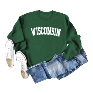 Deep green Wisconsin print sweatshirt paired with casual jeans and white sneakers