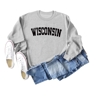 Flat lay of gray Wisconsin sweatshirt styled with blue jeans and white sneakers