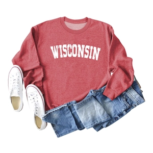 Detailed close-up of Wisconsin letter print on red crewneck sweatshirt fabric