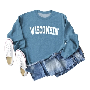 Detailed flat lay of a blue Wisconsin sweatshirt with white vintage lettering