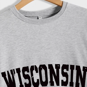 Detail of grey Wisconsin sweatshirt showing ribbed neckline and high-quality cotton texture