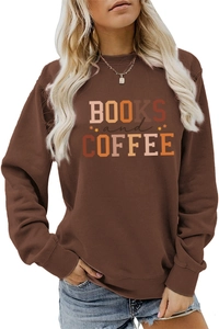 Close-up of Books and Coffee print on brown long sleeve crewneck sweatshirt for women