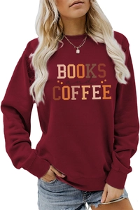 Detail of Books and Coffee slogan print on burgundy crewneck sweatshirt fabric