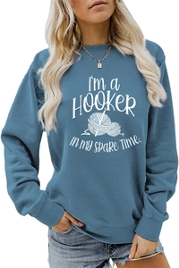Detail shot of navy blue sweatshirt featuring I'M a Hooker crochet hobby design