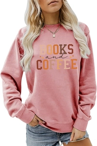 Detailed close-up of Books and Coffee typography on a pink long-sleeved sweatshirt