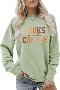 Close-up of Books and Coffee lettering with star detail on sage green sweatshirt
