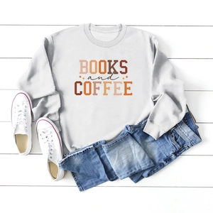 Flat lay of light grey sweatshirt featuring Books and Coffee print with casual denim jeans