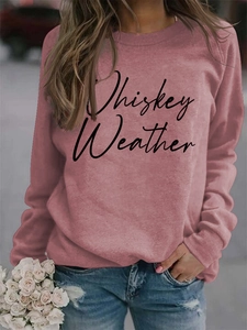 Detail of Whiskey Weather graphic print on a pink long sleeve crewneck sweatshirt