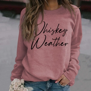 Close-up of Whiskey Weather script print on a mauve crewneck long sleeve sweatshirt