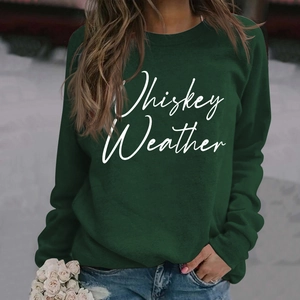 Detail of Whiskey Weather white letter print on dark green long sleeve sweatshirt