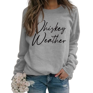 Close-up of Whiskey Weather print on a grey oversized drop-shoulder sweatshirt for women