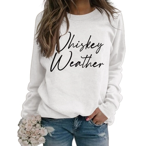 Close-up of Whiskey Weather printed graphic on a white long sleeve cotton sweatshirt