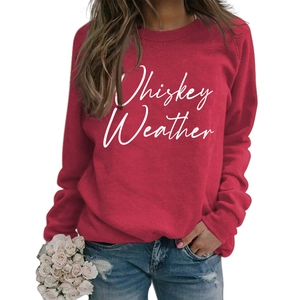 Detail of red crewneck sweatshirt with white Whiskey Weather cursive print and floral accents