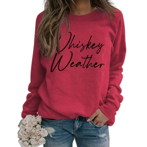 Detail of red crewneck sweatshirt featuring Whiskey Weather cursive typography print