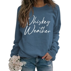 Detail of Whiskey Weather graphic print on a navy blue long sleeve crewneck sweatshirt