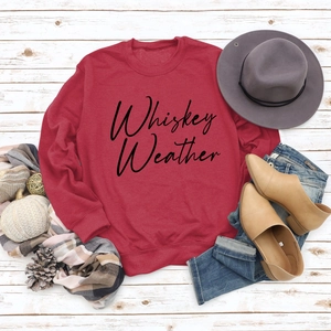 Close-up of Whiskey Weather printed sweatshirt flat lay with autumn style accessories