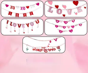 Detail view of glitter Love and Happy Valentine's Day banners with red heart accents