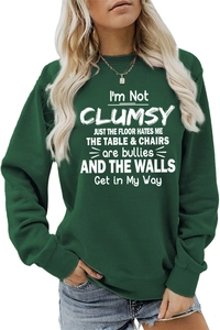 Detail of white humor text print on dark green long sleeve crewneck sweatshirt for women