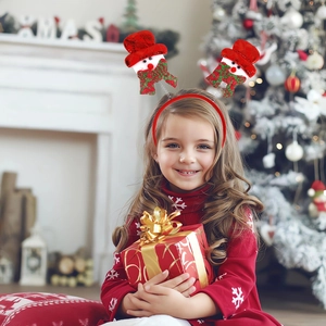 Christmas snowman headband with spring design worn by a child in a festive home setting