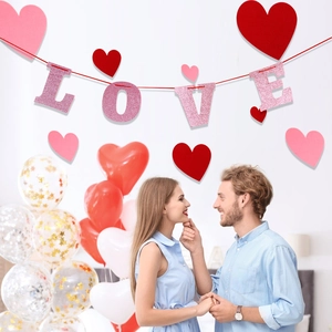 Glitter LOVE banner with red hearts for Valentine's Day proposal and room decoration
