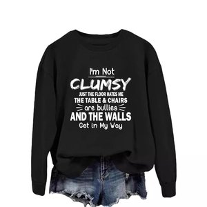Black long sleeve sweatshirt with humor slogan and blue ripped denim shorts