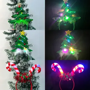 Detail of Christmas headband with glowing LED lights featuring Xmas tree and candy canes