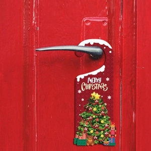 Christmas door hanger featuring festive tree and Santa motifs on red wooden door