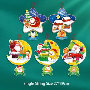 Detail of cartoon Christmas paper ceiling hangers featuring Santa and reindeer motifs