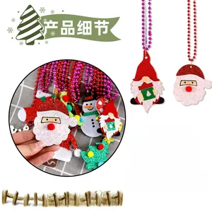 Detailed view of Christmas felt pendant with glitter finish and plastic beaded chain