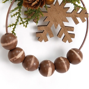 Mini Christmas wreath with wooden beads, pine cone, and snowflake for tree decoration