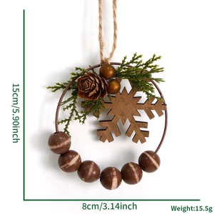 Detail view of 15x8cm Christmas wreath with wood snowflake, pine cone, and striped beads