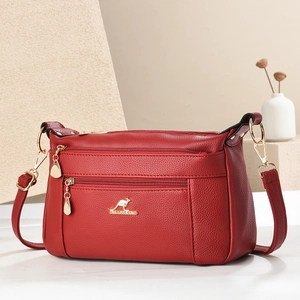 Dark red lychee leather crossbody bag with kangaroo logo and gold zippers