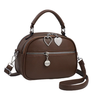 Brown litchi grain leather mini crossbody bag with heart charm and silver hardware