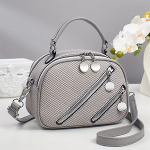 Elegant grey woven handbag with decorative zippers and silver hardware for women