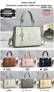 Detail view of multi-compartment ladies handbag with marble pattern and color options