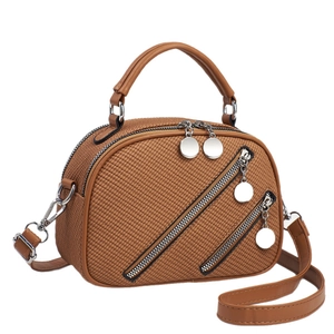 Elegant brown leather tote bag with woven texture and adjustable shoulder strap for women