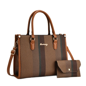 Brown woven tote bag and clutch set with leather trim and gold Darbaoly logo