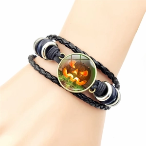 Halloween multilayer leather bracelet featuring a glowing Jack-o'-lantern glass cabochon