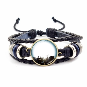 Retro Halloween braided leather bracelet with glass cabochon silhouette design