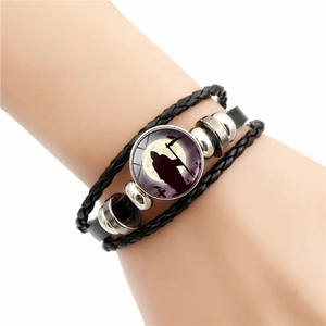 Multilayer woven leather Halloween bracelet featuring a Grim Reaper glass charm and metal beads