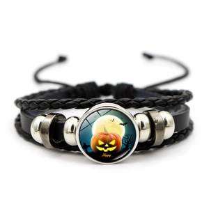 Detail of Halloween leather multilayer bracelet with pumpkin glass cabochon and silver beads