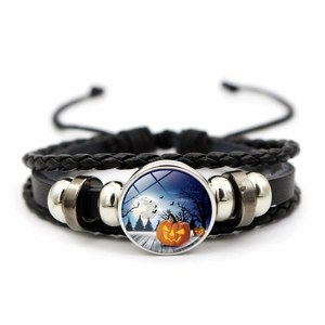 Detailed view of Halloween multilayer leather bracelet with pumpkin glass cabochon